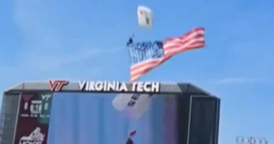 Skydiver rescued after crashing into scoreboard during Virginia Tech football game